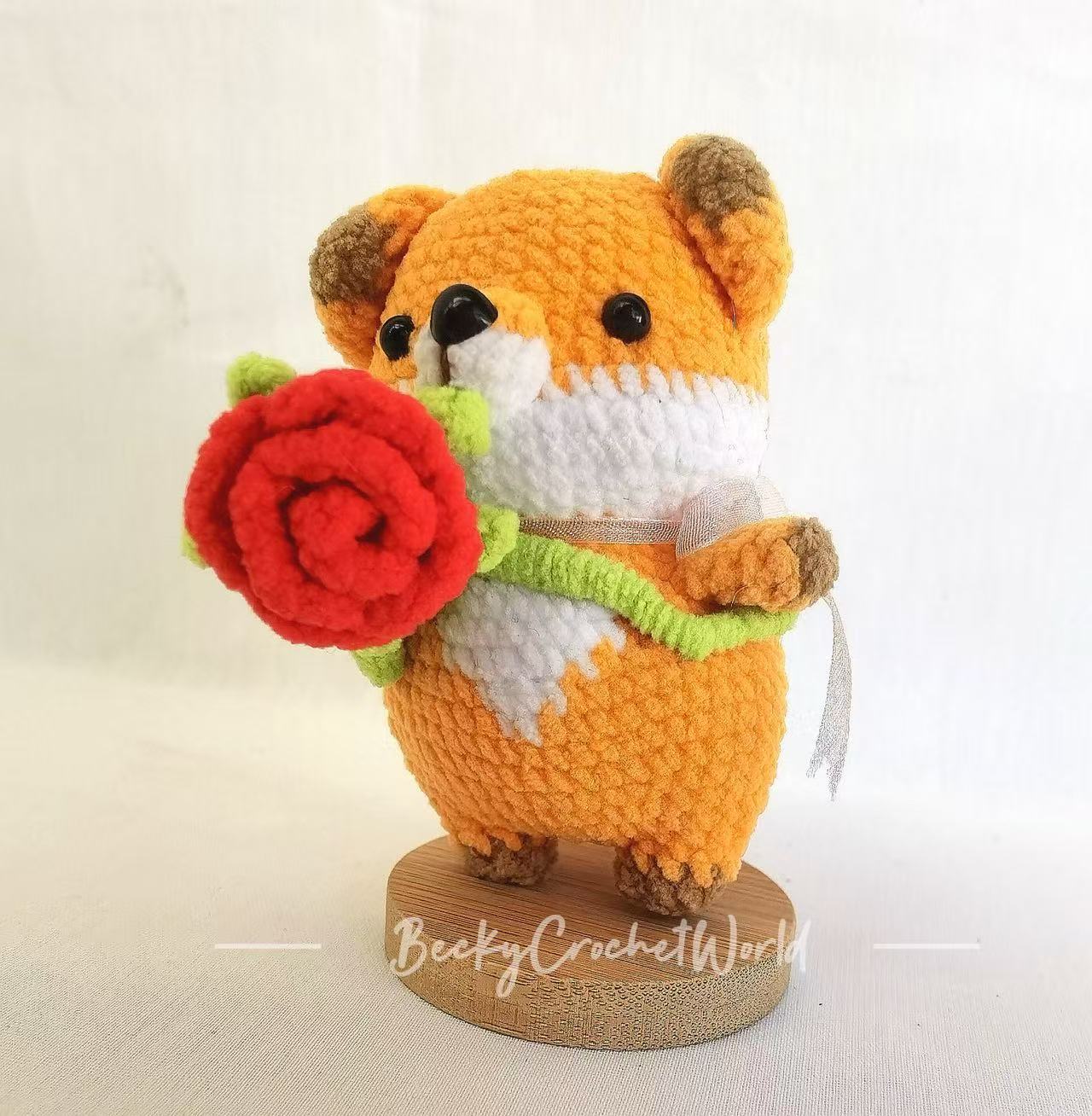 Fox holding a rose